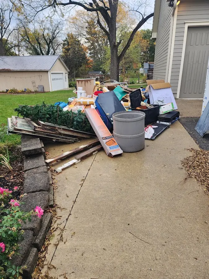 Dumpster being loaded with debris for 10 Yard Dumpster Rental in Walkertown
